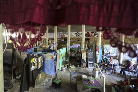 Homeless camp with kitchen, shelves, closet rods found inside bridge over I-70